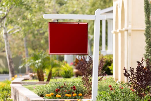 Blank Sale Real Estate Sign in Front of House.