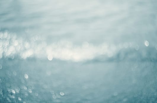 Lights on blue background.Waves.Underwater.
