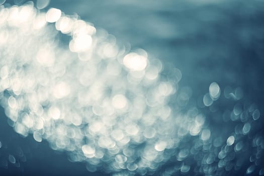 Lights on blue background.Underwater.