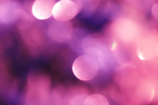 Abstract background with bokeh defocused lights and shadow.Multicolors bokeh.Vintage style.Disco purple lights.