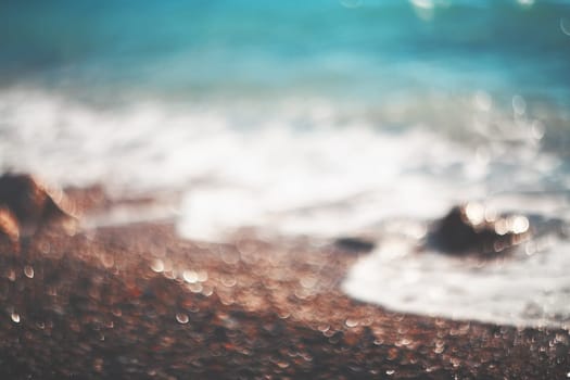 Water bokeh lights on the coastline.Natural background.