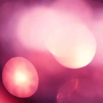 Abstract background with bokeh defocused lights and shadow.Multicolors bokeh.Vintage style.Disco lights.