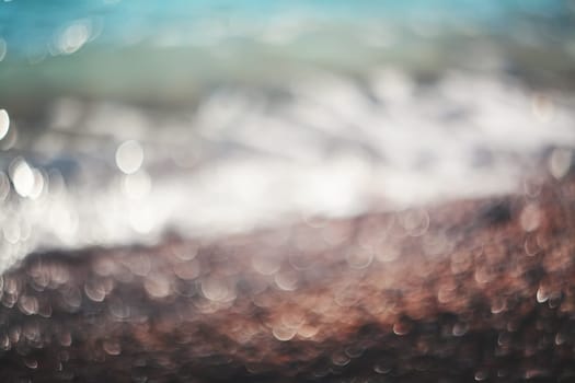 Water bokeh lights on the coastline.Natural background.