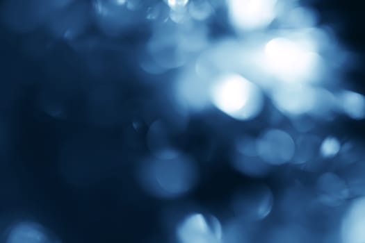 Lights on blue background.Underwater.