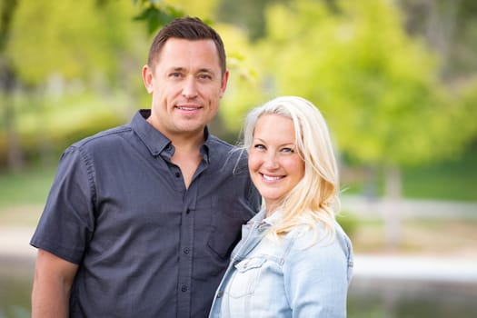 Young Caucasian Couple Portrait In The Park.