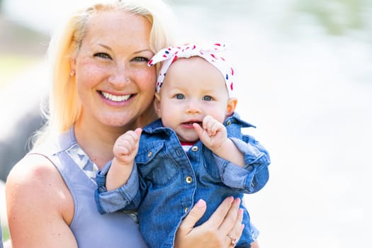 Young Caucasian Mother and Daughter At The Park.