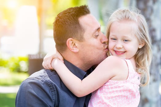 Young Caucasian Father and Daughter Having Fun At The Park.
