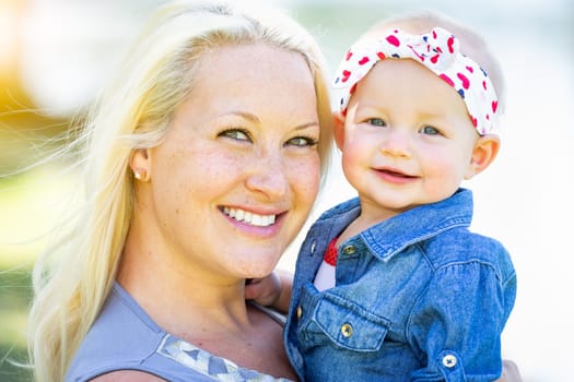Young Caucasian Mother and Daughter At The Park.