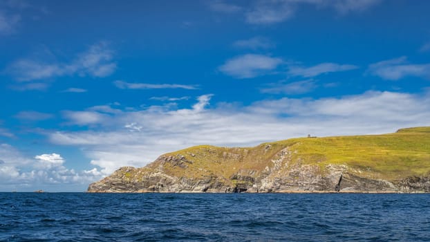 Bray Head coastline seen from Kerry Cliffs and blue waters of Atlantic Ocean on a summer day, Portmagee, Iveragh Peninsula, Ring of Kerry, Ireland