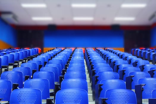 Blurred background of empty lecture hall in university. Closure of all schools and universities due to coronavirus outbreak.