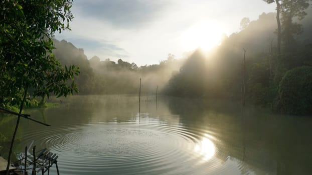 Peaceful moment of sunrise in gray and cloudy sky in the early chilly morning.Concepts of winner, freedom, happiness.