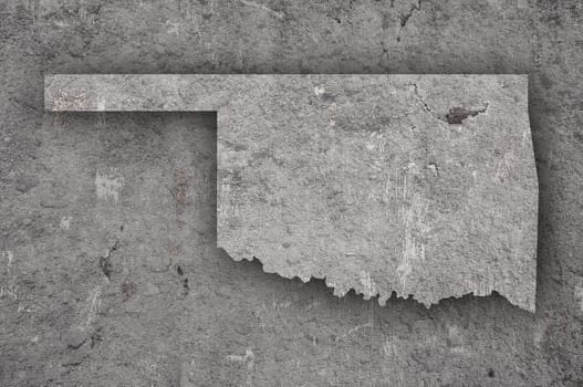 Map of Oklahoma on weathered concrete