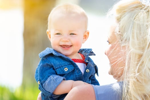 Young Caucasian Mother and Daughter At The Park.