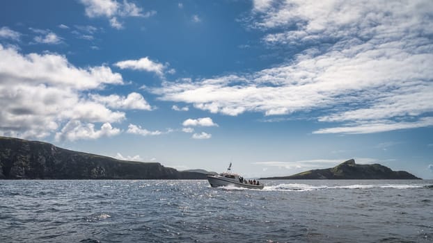 Tourists on a boat cruise to visit Skellig Michael island where the Star Wars were filmed, Ring of Kerry, Portmagee, Wild Atlantic Way, Ireland