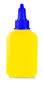 Yellow tube of glue isolated on white background