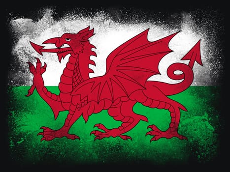 Wales Flag design composition of exploding powder and paint, isolated on a black background for copy space. Colorful abstract dust particles explosion. Euro 2020 football symbol for printing.