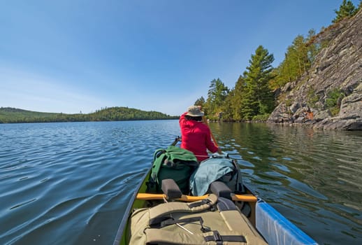 Paddling Along a Remote Lakeshore on Kekekabic Lake in Minnesota