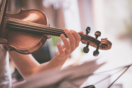 Young girl practices on her violin, acoustic music