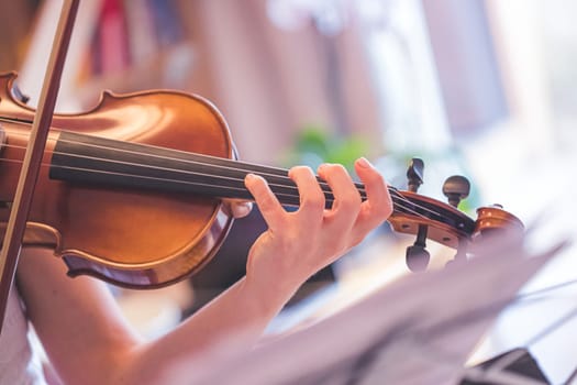 Young girl practices on her violin, acoustic music