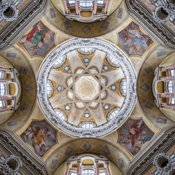 TURIN, ITALY - CIRCA MAY 2021: Antique baroque interior with vintage decoration. Royal Church of San Lorenzo (St. Lawrence).