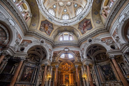 TURIN, ITALY - CIRCA MAY 2021: Antique baroque interior with vintage decoration. Royal Church of San Lorenzo (St. Lawrence).