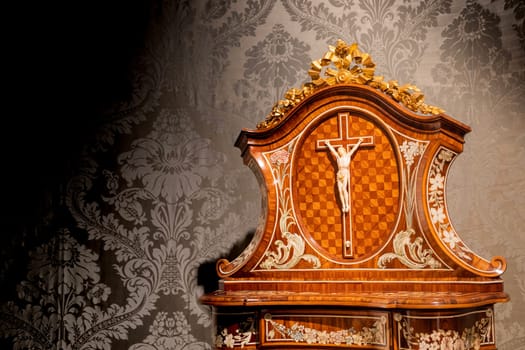 TURIN, ITALY - CIRCA MAY 2021: old crucifix made of wood and ivory (1750). Jesus Christ symbol of resurrection and life after the death.