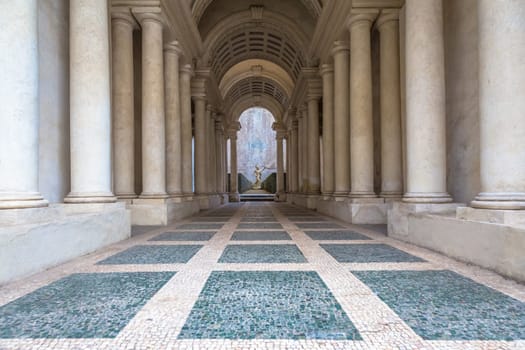 ROME, ITALY - August 23, 2018: Prospettiva Borromini (Borromini Perspective), corridor with marble columns in this luxury palace