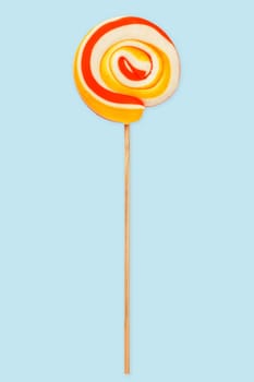 Sweet colourful Lollipop isolated over light blue background