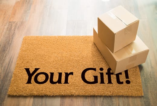 Your Gift Welcome Mat On Wood Floor With Shipment of Boxes.