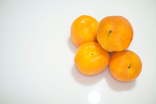 Spanish apricots heap. Isolated over white