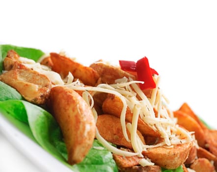plate of decorative country potatoes with cheese