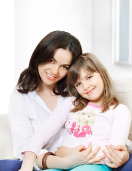 Portrait of happy mother and her smiling daughter