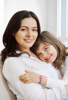 Portrait of happy mother and her smililing daugther