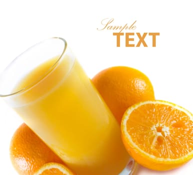 closeup orange juiceand few oranges on white