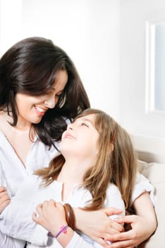 Portrait of happy mother and her smiling daughter