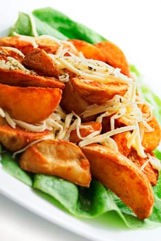 plate of decorative country potatoes with cheese