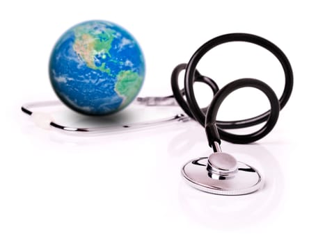 Medical concept with stethoscope and planet Earth over white background