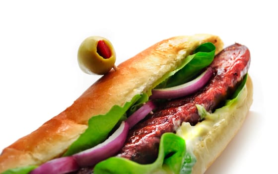Delicious decorative sandwich with sausage over white background