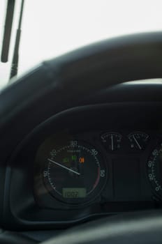 Fog lights indicators at car dashboard. Bad-weather driving concept