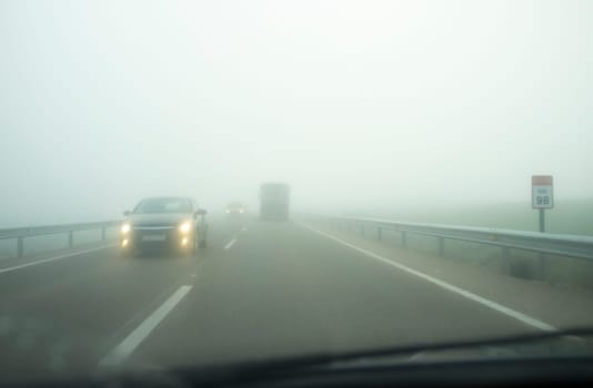 Driving under dense fog. Extreme bad-weather conditions