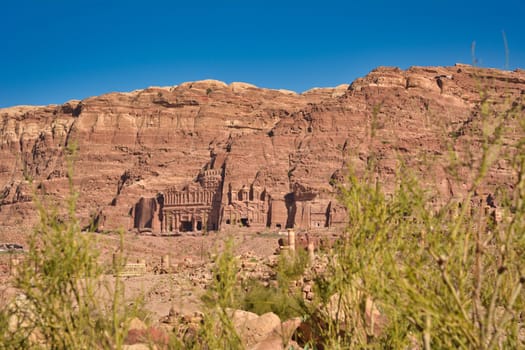 Distant view on Urn and Palace Tomb at historical site of Petra, Jordan.