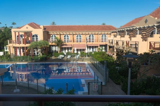 View of holiday apartment complex with swimming pool in Meloneras, Gran Canaria in Spain.