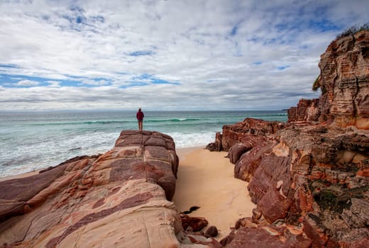 Iron rich red rocks with sandstone offer a dramatic landscape along the coastline and  beaches along the sapphire coast of far New South Wales