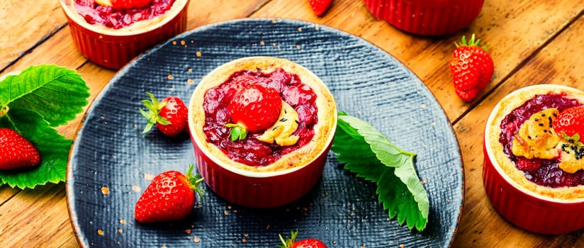 Strawberry shortcake pies on the plate.Tasty tartlets with fresh strawberries.Sweet dessert