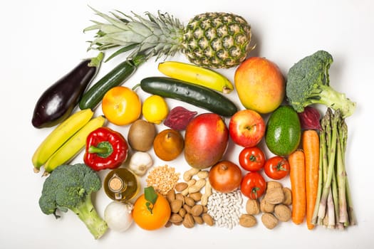 Healthy food clean eating selection: fruit, vegetable, seeds, superfood, cereals, leaf vegetable on white with copy space. Diet concept. Flat lay, top view