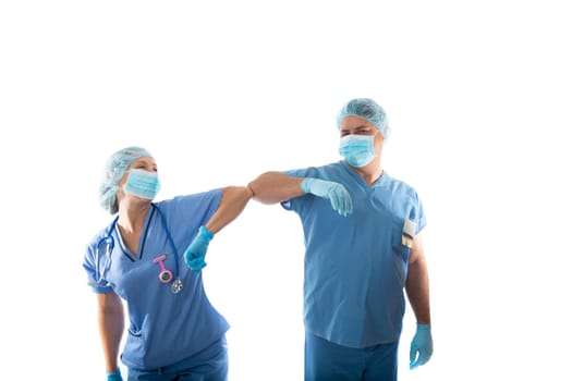 nurses in scrubs elbow bump instead of shaking hands during COVID-19 influenza pandemic