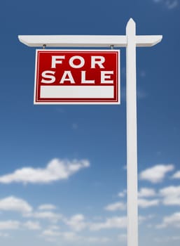 Left Facing For Sale Real Estate Sign on a Blue Sky with Clouds.
