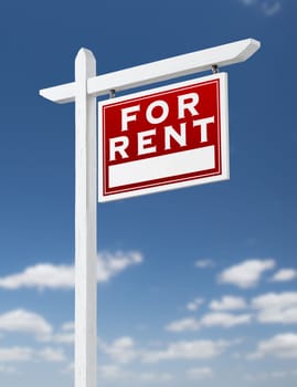 Right Facing For Rent Real Estate Sign on a Blue Sky with Clouds.