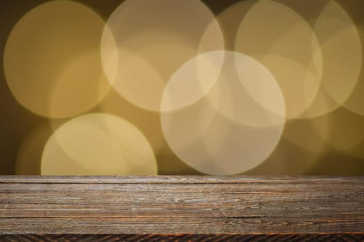 The background is an empty wooden board and a wall of blurred bokeh lights. For product demonstrations, free space, layout, mockup, perspective board, background board.