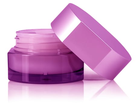 The pink cosmetic cream in container isolated on white background